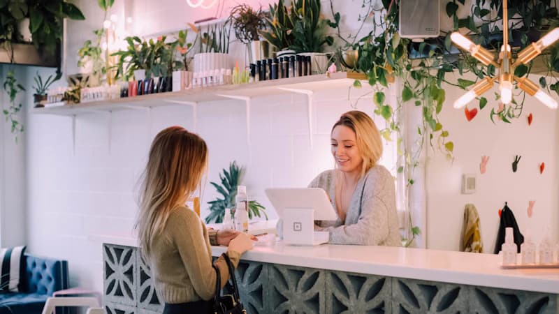 Smiling hotel guests at the checkout counter